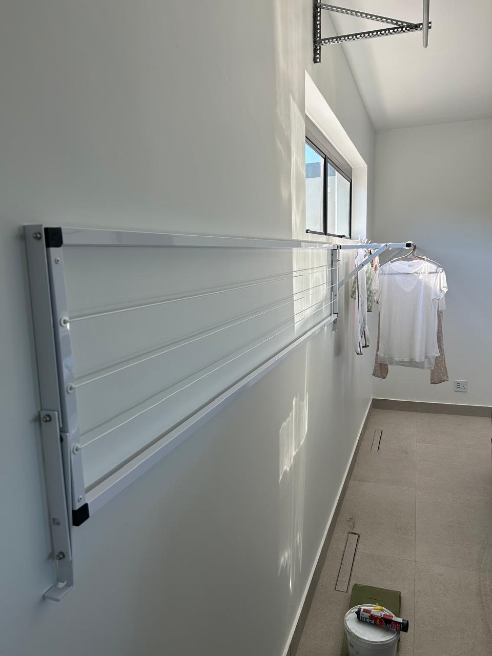 Wall-mounted Foldaway Washline installed at a modern home